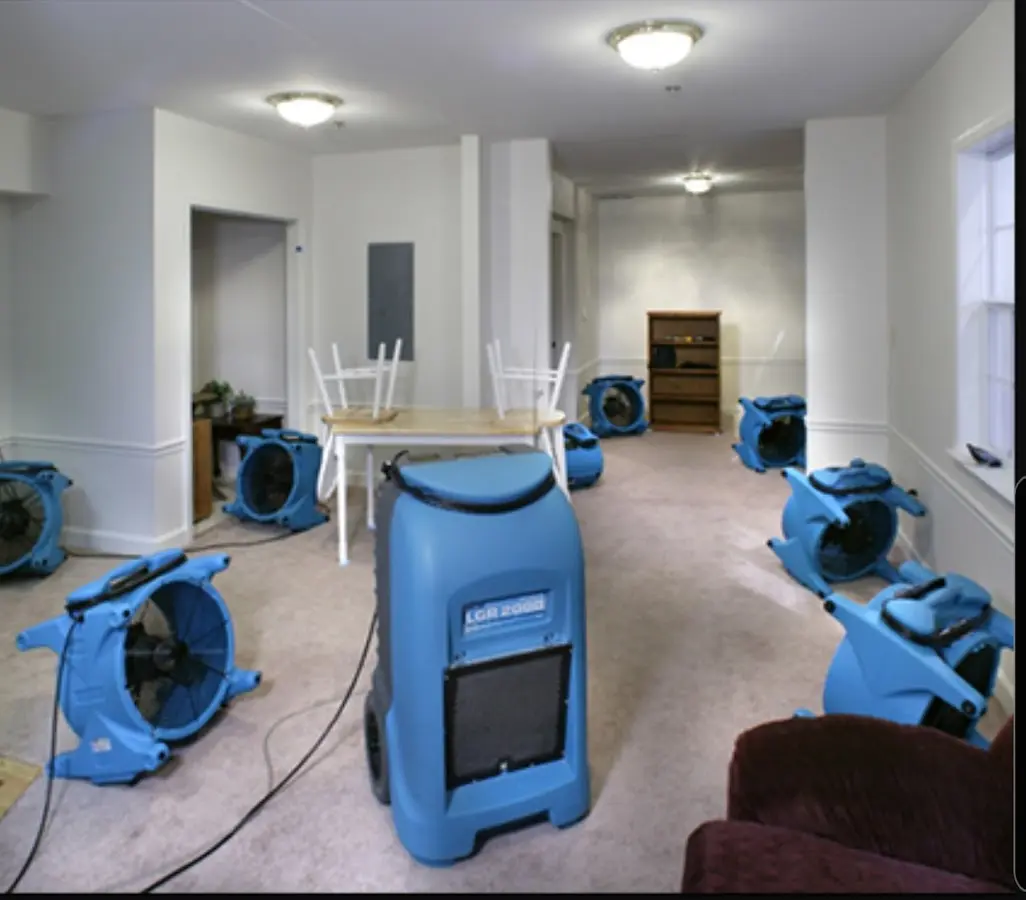 Air movers and dehumidifier setup for Water Damage Restoration in Preston